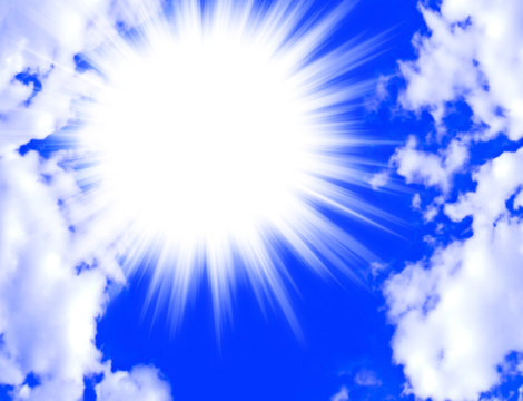 Star Burst Of Light Offset In A Blue Sky With White Clouds And C