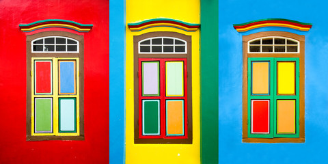 Collage of 3 colorful windows on the facade of a house in Little India, Singapore