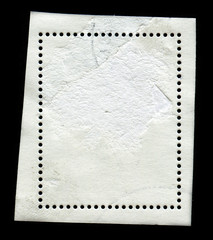 Reverse side of a postage stamp.