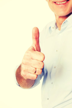 Mature man gesturing ok sign