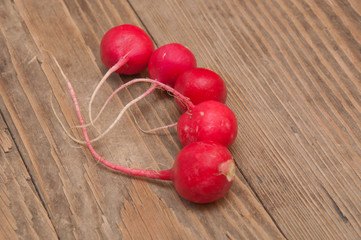 radishes on a wooden background