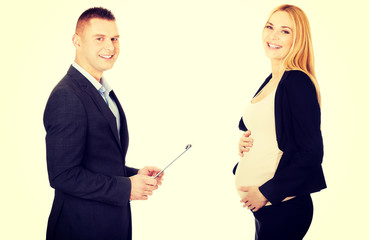 Pregnant businesswoman talking with her partner