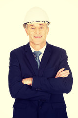 Smiling businessman with hard hat