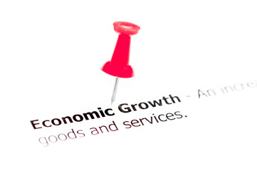 Word Economic Growth pinned on white paper with red pushpin