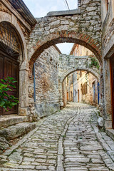 Fototapeta na wymiar Typical street in hilltop town of Bale or Valle in Istria, Croatia