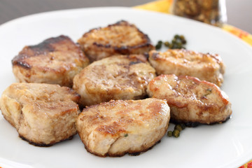 Roasted pork fillet in white plate