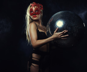 lady in mask with disco ball