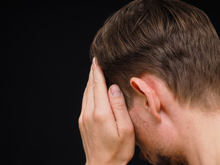 Fototapeta premium Male caucasian person covering face with one hand isolated towar