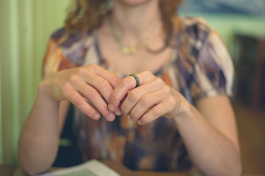 Young woman sitting at table in cafe