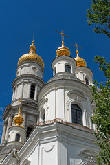 Fototapeta na wymiar The bell tower of the Assumption Cathedral (1844) in sunny day in Kharkiv, Ukraine