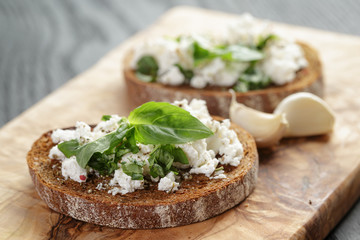 rye sandwich or bruschetta with ricotta, herbs and basil