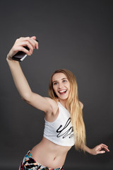 Fototapeta premium young pretty blonde women taking selfie