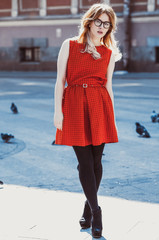 Young hipster woman wearing red dress 