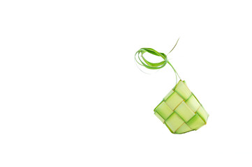Ketupat wrapped in coconut leaves on a white background.