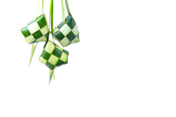 Ketupat wrapped in coconut leaves on a white background.