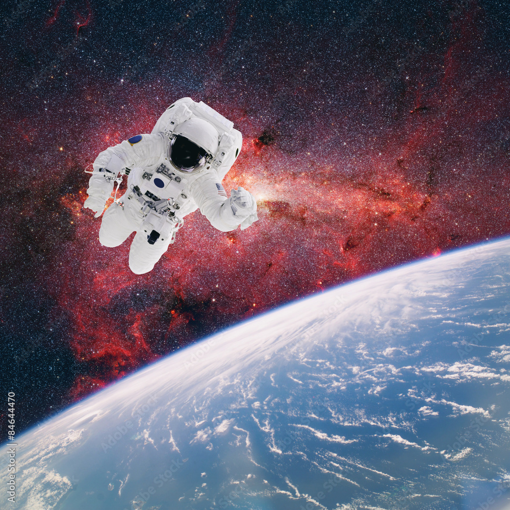 Canvas Prints astronaut in outer space with planet earth as backdrop. elements