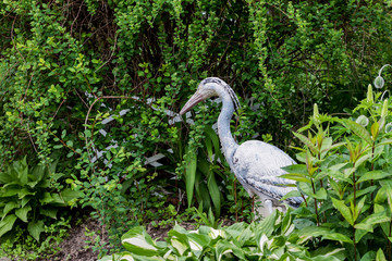 Plaster sculptures of assistants in a garden