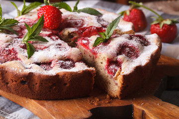 strawberry pie with mint on a cutting board macro. Horizontal

