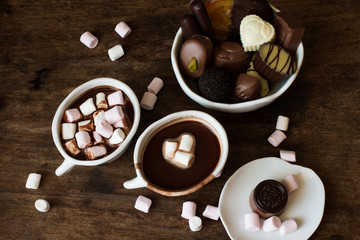 Belgian chocolate in a white bowl on a wooden table