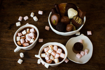 Belgian chocolate in a white bowl on a wooden table