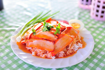 thai food is name rice red pork sauce