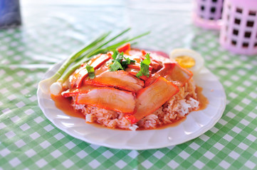 thai food is name rice red pork sauce