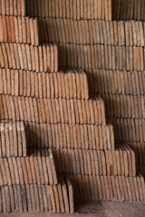 Close view of a pile of traditional mud bricks production.