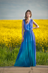  woman in blue dress posing outdoor