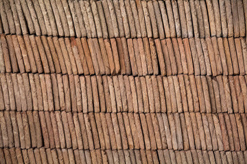 Close view of a pile of traditional mud bricks production.