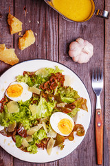Fresh salad with egg and parmesan cheese