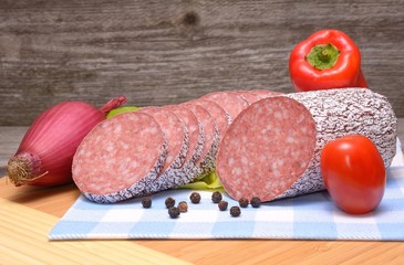 Salami on wooden table