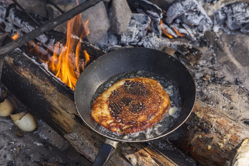 Cooking pancakes on a griddle in field conditions