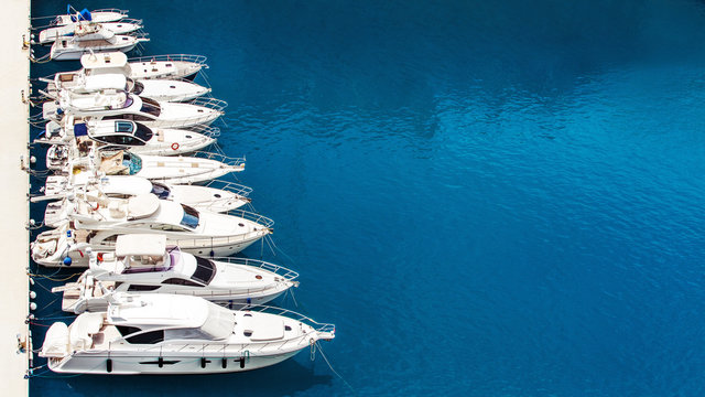 Fototapeta Luxury yachts dropped anchor in seaport of Monte Carlo, Monaco