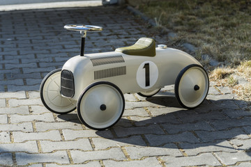 old metal car for children from the 19 th century