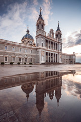 Obraz premium Almudena Cathedral in Madrid, Spain. Reflection on a puddle.
