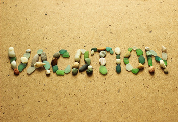 Vacation note. sea shells and beach stones. summer background. Your text here.