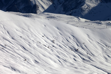 Fototapeta premium Top view on off-piste slope at evening