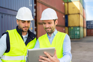 Two young attractives dockers working on the dock