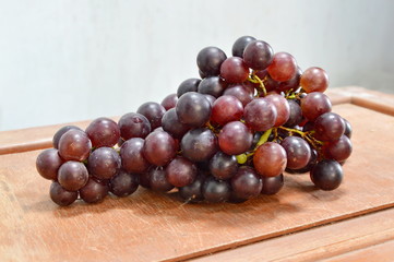 red grape on wood table