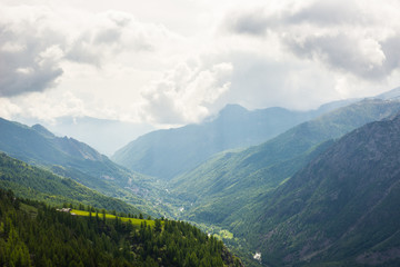 Fototapeta na wymiar Dramatic sky in alpine valley