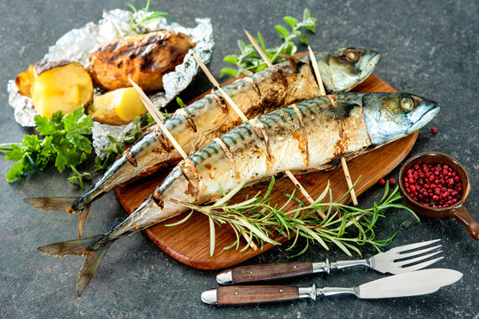 Grilled mackerel fish with baked potatoes