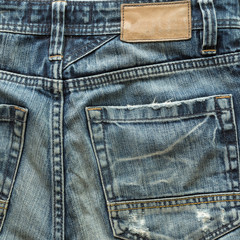 Fototapeta premium jeans pants with back pocket and brown leather tag