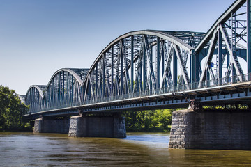 Fototapeta na wymiar Poland - Torun famous truss bridge over Vistula river. Transport