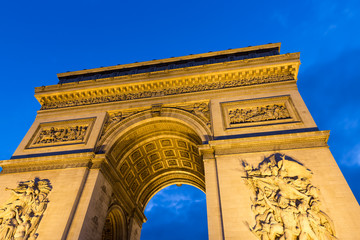 Fototapeta na wymiar Evening view of Illuminated Arc de Triomphe in Paris