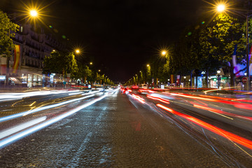 Evening streetview with illumination and traffic of Paris Champs Elysees