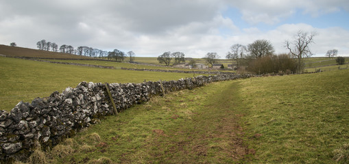 Beautiful bright landscape image of Peak District on sunny Sprin