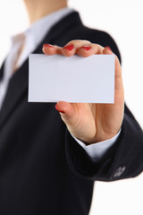Female hand holding a blank business card