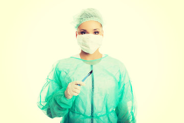 Female doctor with a scalpel