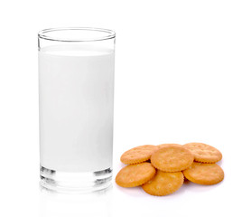Cracker and fresh milk in the glass on white background