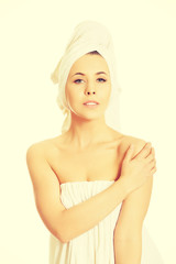 Beautiful woman wrapped in towel